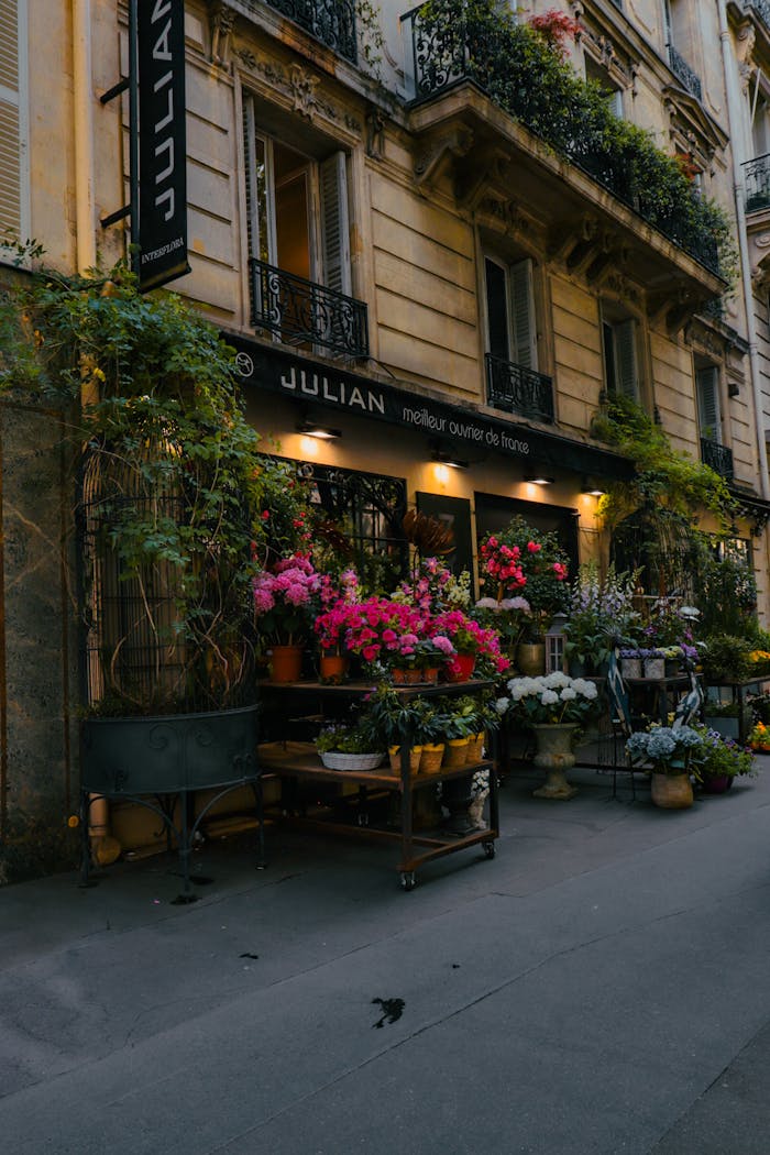 Elegant Parisian flower shop with colorful blooms and classic architecture in Paris, France.